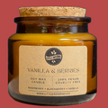 Jar candle labeled 'Vanilla & Berries' with a cork lid on a red background