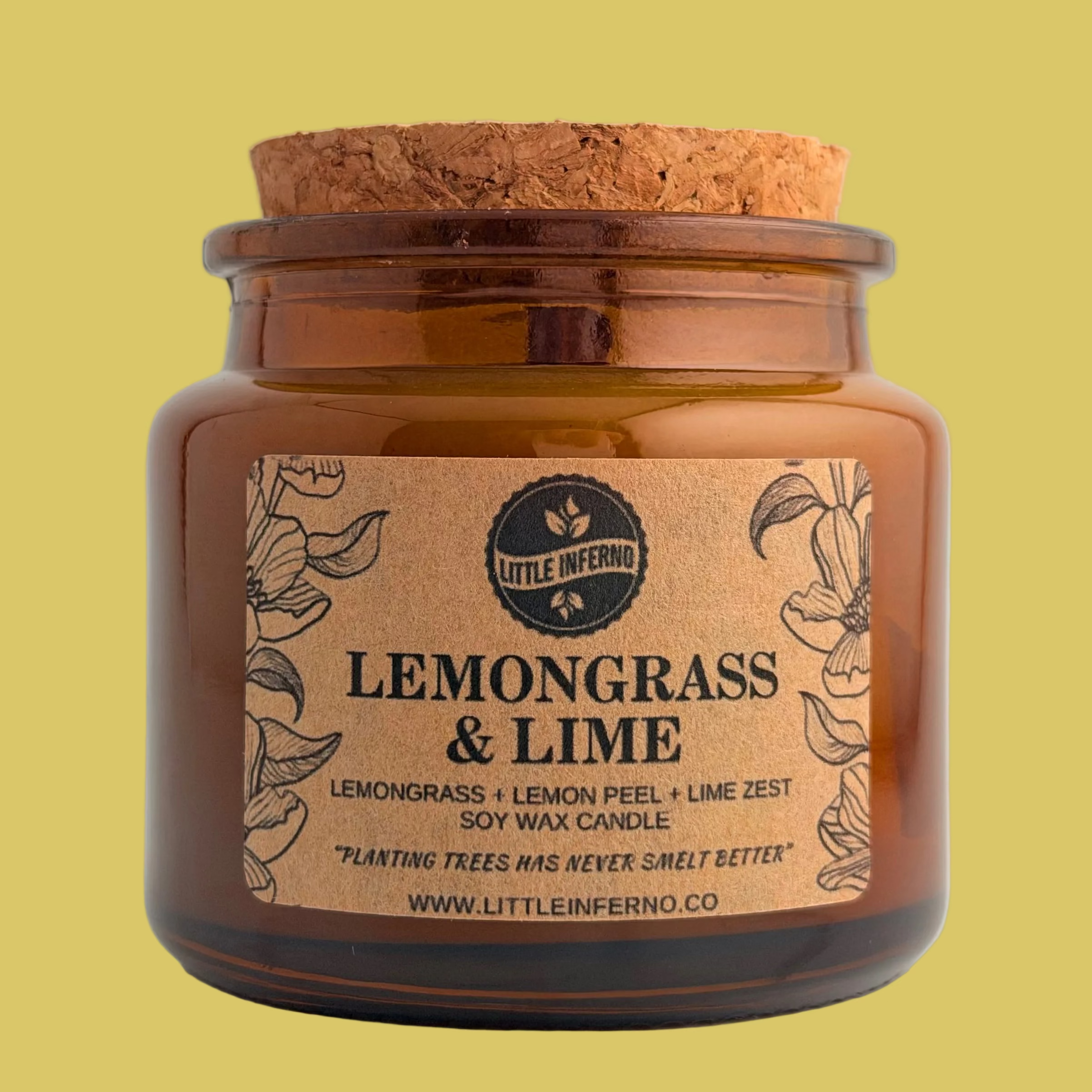 An amber glass jar candle with a natural cork lid and a tan paper label reading 'LEMONGRASS & LIME' by Little Inferno, photographed against a plain light gray background.