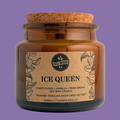 An amber glass jar candle with a cork stopper and a brown paper label reading 'ICE QUEEN' 